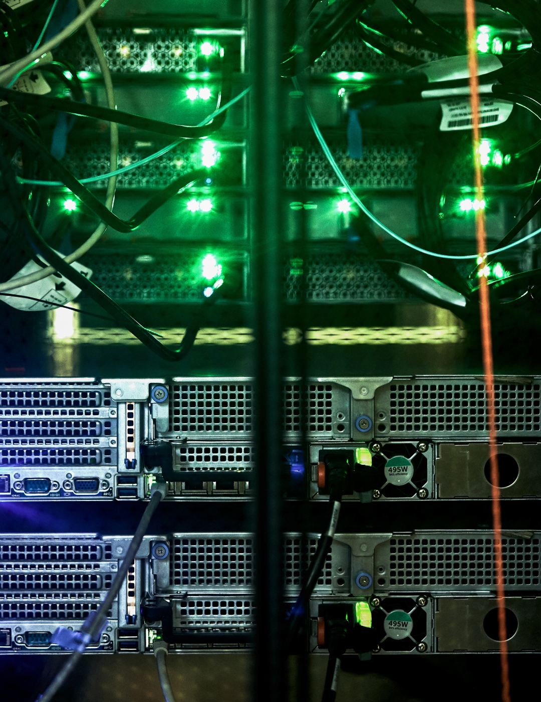Server rack with glowing green indicator lights.