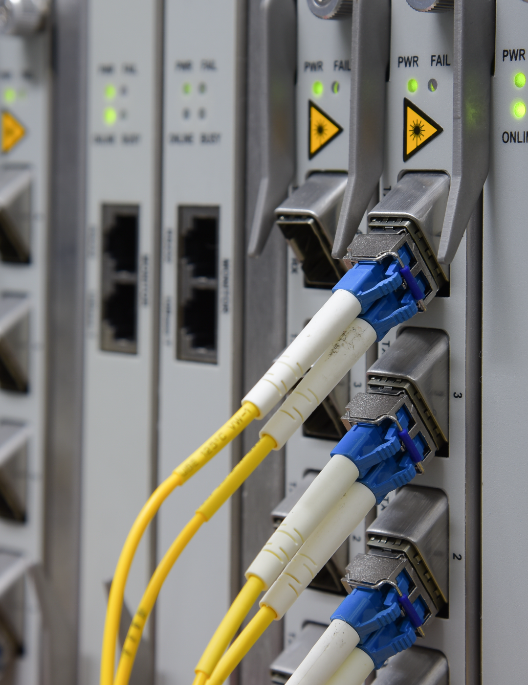 Fiber optic cables connected to network equipment.