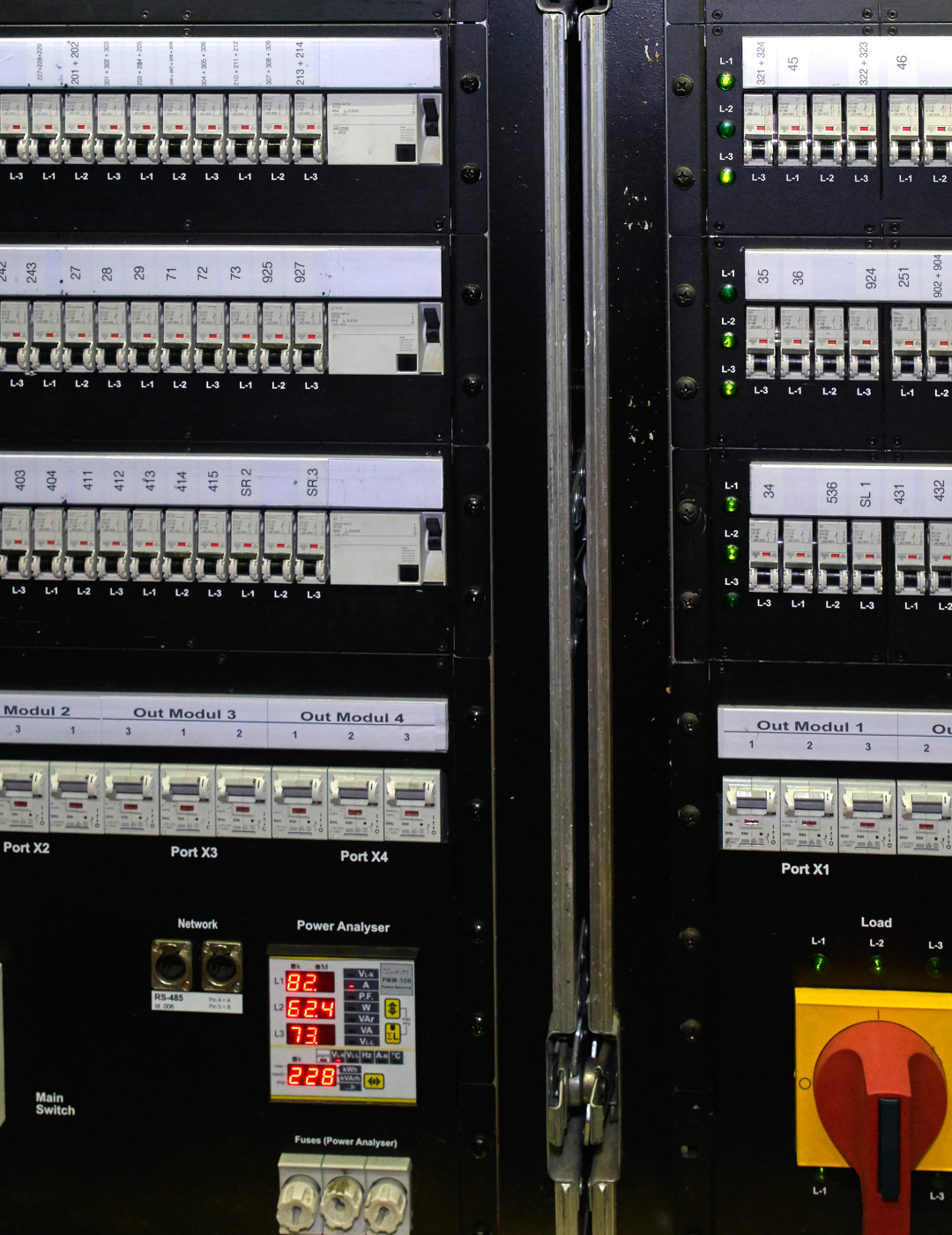 Electrical control panel with switches and meters.