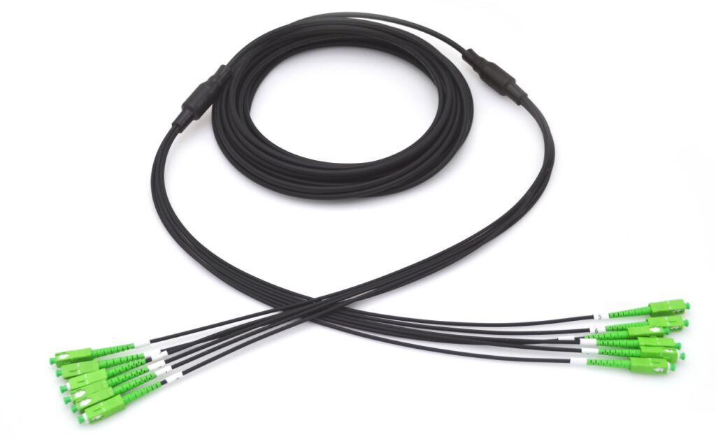 Fiber optic cable with green connectors.