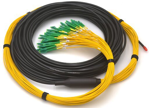 Coiled fiber optic cables with connectors.